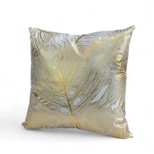 Cojín decorativo cuadrado 45x45 cm con diseño de hojas doradas en tela bouclé.