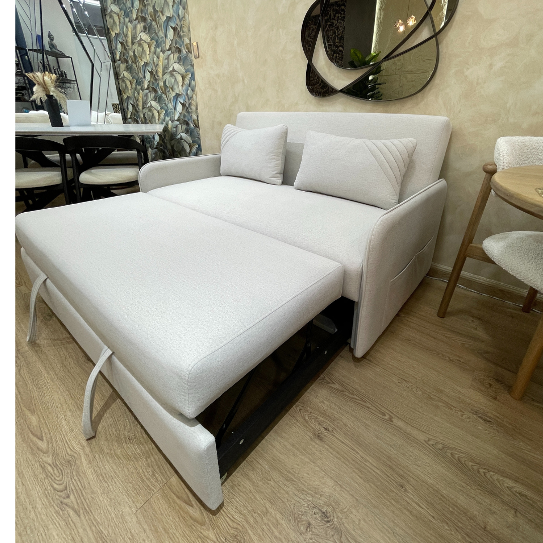 Vista lateral derecha de sofa cama aleman extendido con funcion para descansar